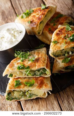 Bolani Is A Traditional Afghani Flatbread Stuffed And Baked With Either Potato, Onion, Cilantro Fill