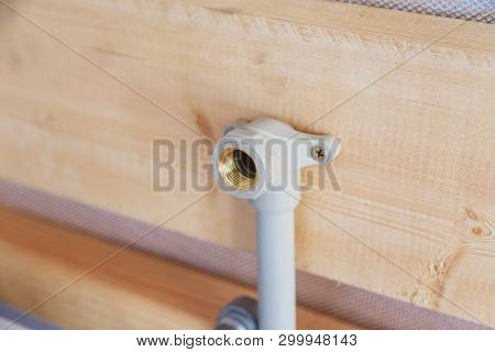 Plumbing Water Supply Fixed On Wooden Wall