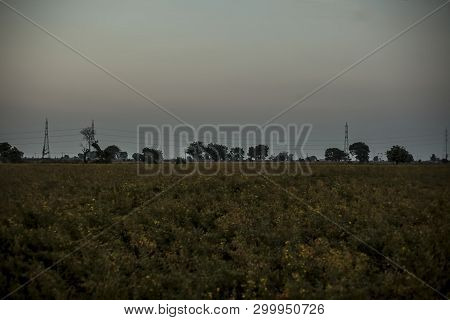 Sunset Shot Of Mountains And Empty Fields.