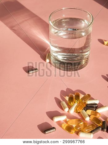 Pills Or Dietic Supplements On The Pink Backgound