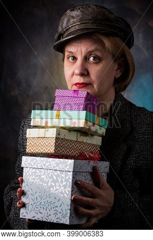 A Man Accepts A Long-awaited Gift In A Beautiful Package. A Cardboard Box With A Surprise Inside.