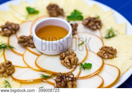 Served Tasty Meal With Walnut And Chese On A Plate In Restaurant Close Up View.