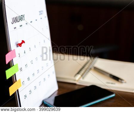 Close Up The Calendar On The Brown Table In Planning Ideas.