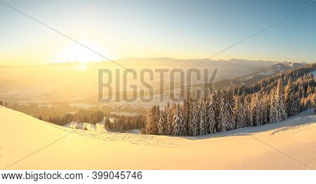 Beautiful Sunrise In Snow Mountains Landscape. Amazing Yellow Sunshine. Allgau, Mittag Mountain, Bav