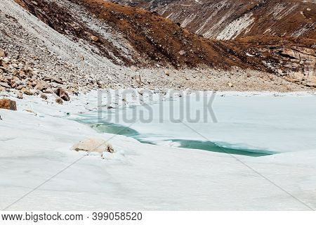 Amazing Blue Gokio Lake Under Ice And Snow, Nepal, Himalayas