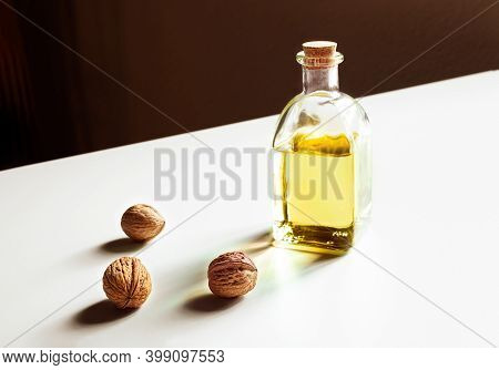 Walnut Oil On A White Table