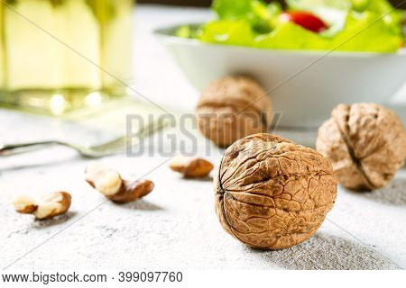 Walnuts On White Table Close-up