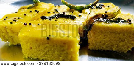 A Closup Shot Of Gujarati Khaman Dhokla Or Steamed Gram Flour Snack