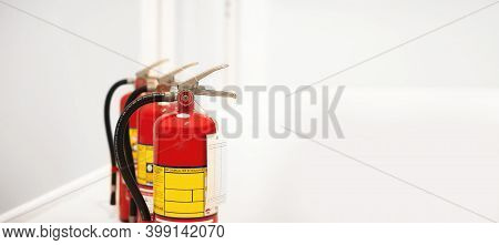 Red Fire Extinguisher Available In Case Of Fire Emergency.