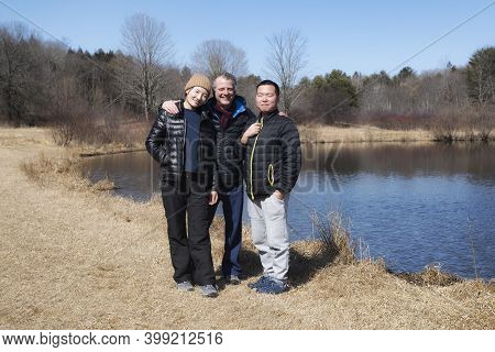 Friends Visiting  Sunnybrook State Park In Torrington Connecticut On A Blue Sky New England Day.