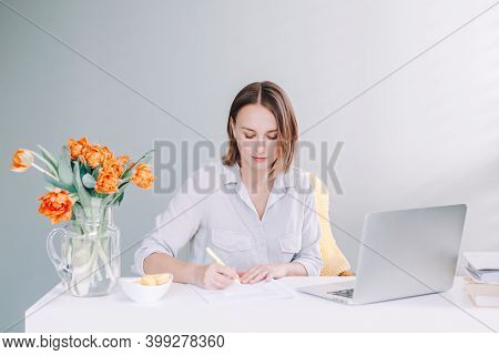 Beautiful Middle Age Woman Sitting At Desktop Table Working On Laptop Computer. Work Business From H