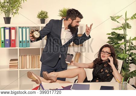 Its Not Proper Timing. Stressed Director Point At Clock While Manager Talk On Phone And Drink Coffee