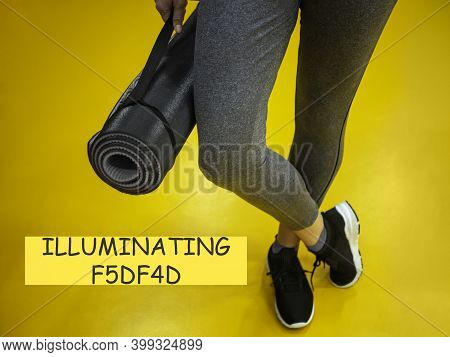 Female Legs In A Sports Ultimate Gray Suit And Mat Ready Sporting