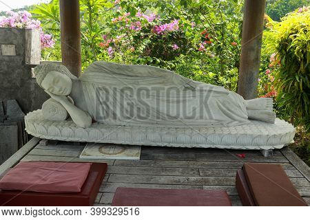 Statue Of Sleeping Buddha At Vihara Dharma Giri, Buddhist Temple In The Village Of Pupuan In Tabanan
