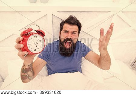Feeling Tired And Stressed. Stressed Man Shouting At The Alarm Clock. Hate Noise Of Alarm Clock. Man