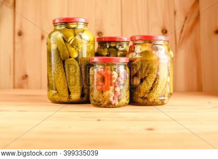 Pickled cucumbers in a jar. Autumn harvesting. Pickled and salted vegetables. Preservation for the winter. Summer country hobby.