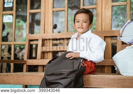 Student With Indonesian School Uniform Getting Ready To School