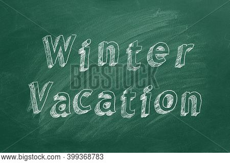 Hand Drawing Text Winter Vacation On Green Chalkboard. 2d Ilustration