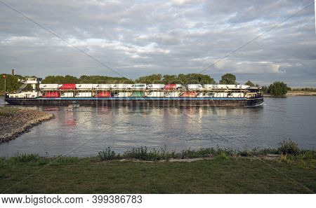 Inlandshipping Container Vessel Transportation Containers Over The River In The Netherlands Waal Riv