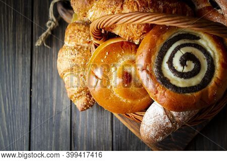 Top View Of Assortment Of Different Cereal Bakery: Bread, Pasties, Buns, Pretzel And Croissant In Ba