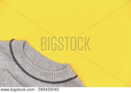 Color Of The 2021 Year 17-5104 Ultimate Gray And 13-0647 Illuminating. Part Of A Knitted Pullover In