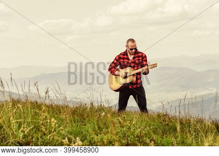 Your Favorite Radio. Western Camping And Hiking. Happy And Free. Cowboy Man With Acoustic Guitar Pla