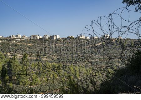 The Palestinian Village Beit Surik, Behind Barbed Wire, As Seen From The Israeli Side Of The Fence, 