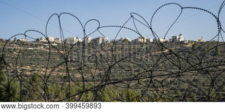 Beit Surik, Israel - December 3rd, 2020: The Palestinian Village Beit Surik, Behind Barbed Wire, As 