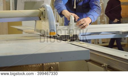 A Man Cuts A Wooden Slab On A Format Cutting Machine.