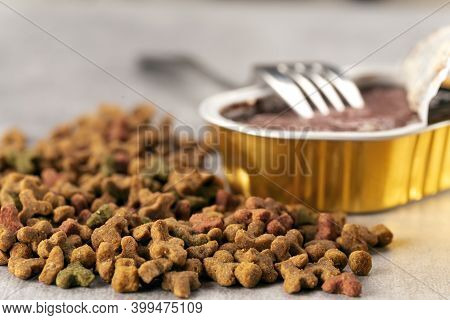 Wet And Dry Pet Food. Cat Or Dog Pate On Old Table. Top View