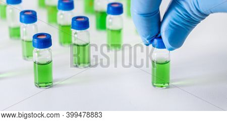 Scientist Puts Vial With Plant Extracts For Hplc Analysis. Natural Products For Development Drugs An