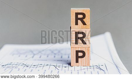 Letter Of The Alphabet Of Rrp On A Grey Background. Rrp - Recommended Retail Price