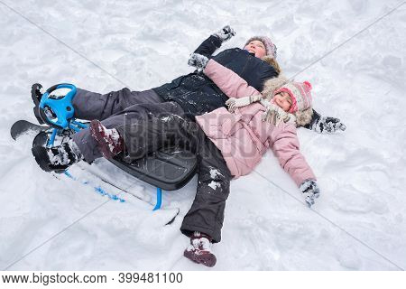 Children Play Outdoors In Winter. Winter Vacation