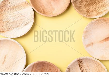 Betal Palm Leaf Plate (biodegradable, Compostable, Disposable Or Eco Friendly Plate) On Yellow Backg