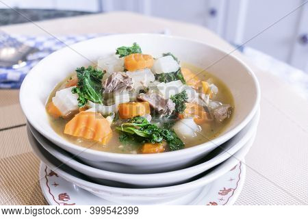 Close Up Of Pork Soup With Mixed Vegetables, Carot, Chines Cabbage, Kale, For Healthy In Asian Count