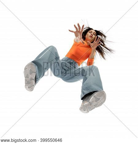 Dancing. Young Stylish Woman In Modern Street Style Outfit Isolated On White Background, Shot From T