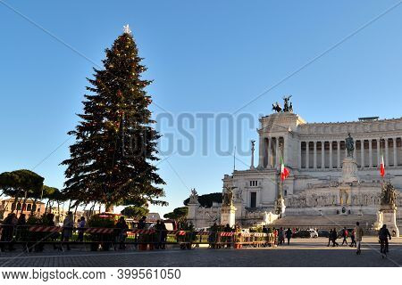 Rome, Italy - December 13th 2020: View Of The Famous Christmas Tree In Piazza Venezia With Few Touri