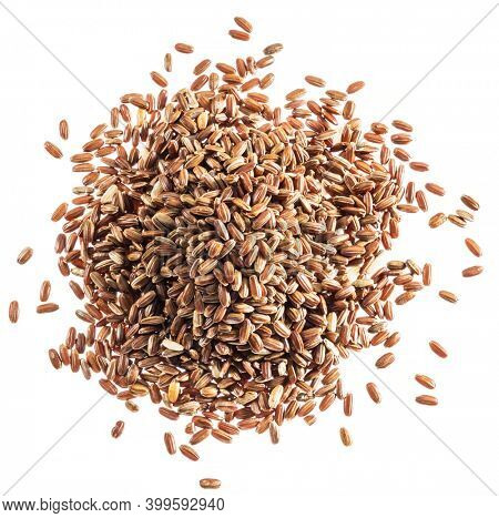 Brown rice heap - whole grain rice with outer hull or husk. Top view.