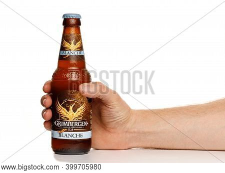 Lviv, Ukraine - November 26, 2020: Grimbergen Beer Blance Bottle On A White Background In Hand