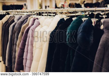Luxury Mink Coats. Grey, Brown, Pearl Color Fur Coats On Showcase Of Market. Best Gift For Women Is 