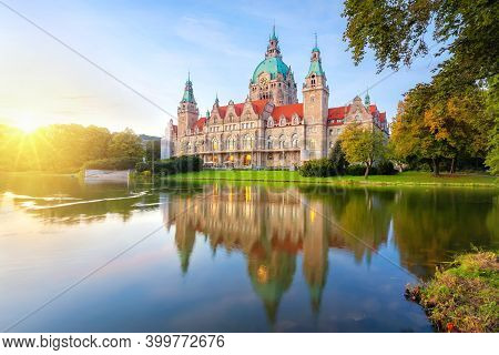 Hanover, Germany. Building Of New Town Hall Reflecting In Water On Sunset (hdr-image)