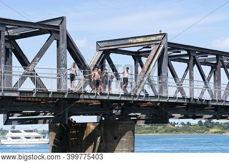 Tauranga New Zealand - December 6 2020; Jumping From Historic Steel Truss Tauranga Railway Bridge In