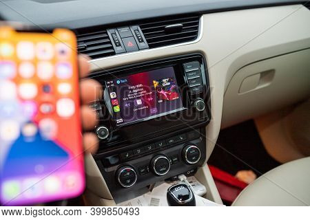 Paris, France - Nov 11, 2020: Hand Holding Smartphonew With Running In Background Apple Music With P