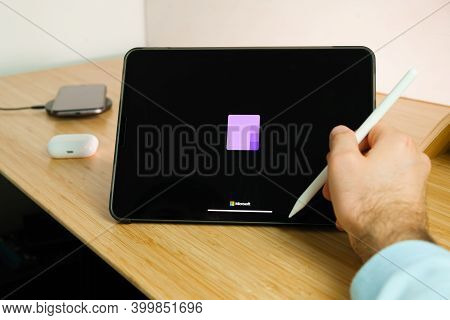 Microsoft Onenote Is Used With Apple Pencil On Ipad Pro Tablet . Man Using Application On The Tablet