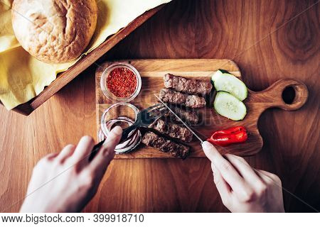 Top View Of Person Eating Traditional Turkish Meal Cevap. Restaurant Meal