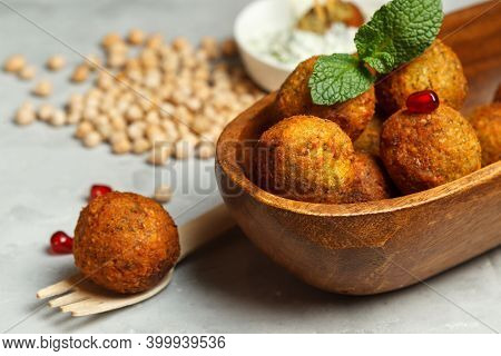 A Vegetarian Dish, Falafel, Fried Chickpea Balls In A Small Wooden Bowl. Close-up With Space.chickpe