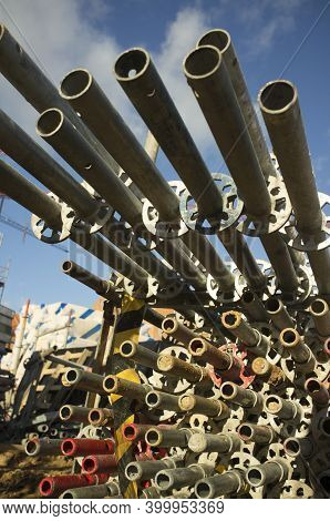 Unmounted Scaffolds Elements Piled At Construction Site. Selective Focus