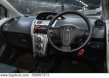 Novosibirsk, Russia - December 17, 2020:  Toyota Vitz, Dark Car Interior - Steering Wheel, Shift Lev