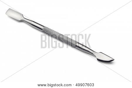 Metal manicure and pedicure cuticle pusher isolated on white