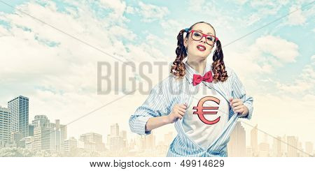 Young woman acting like super hero with euro sign on chest